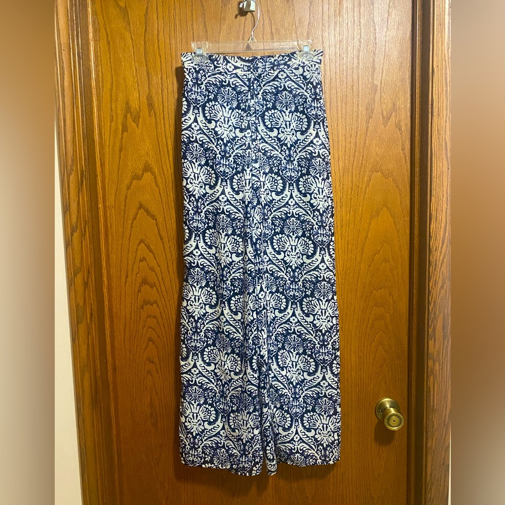 Women’s slit front pants with built in shorts. Size medium